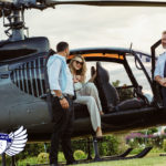 Couple traveling by a private helicopter